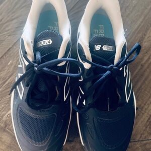 New Balance Navy and White shirt softball cleats molded